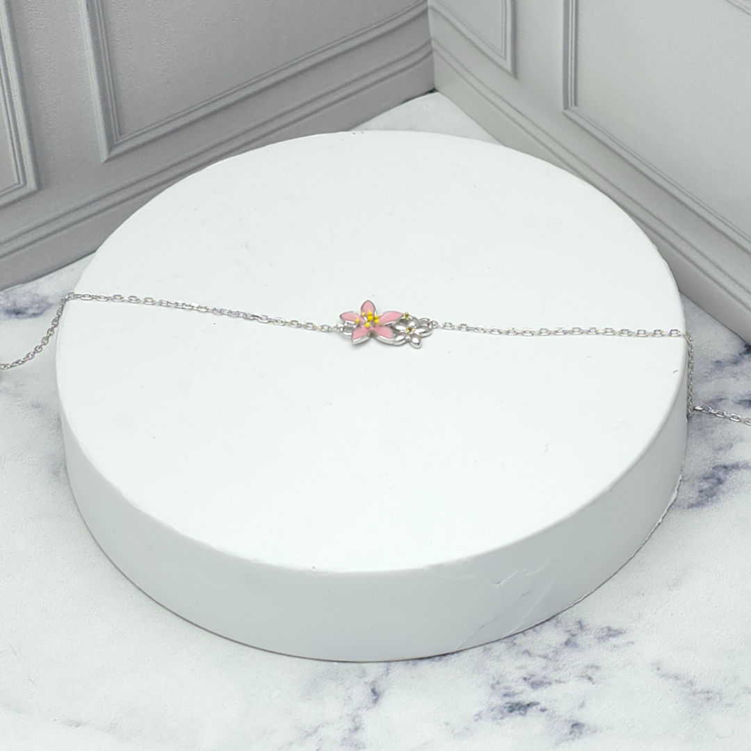 Pulsera de plata con flor rosada