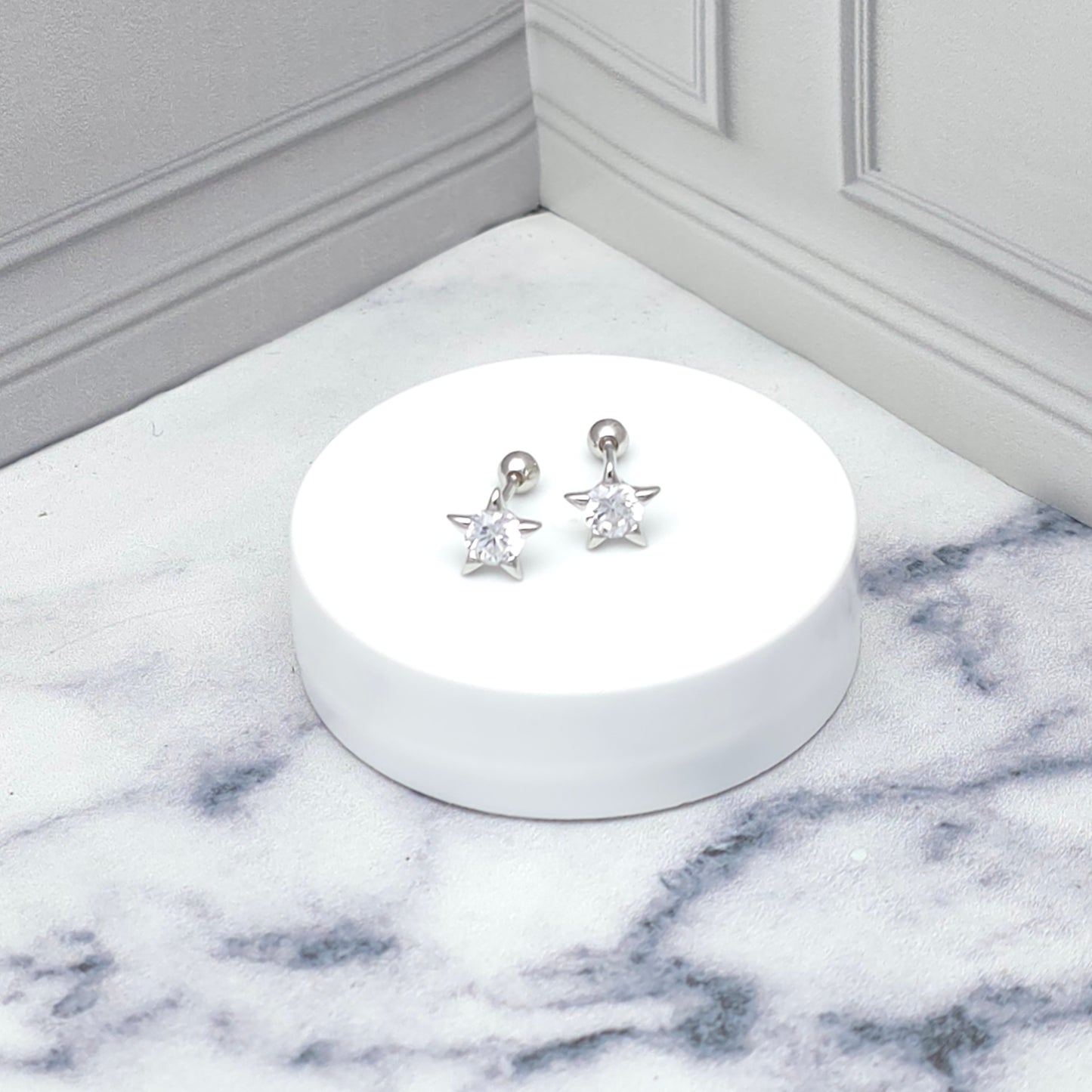 Aretes de plata con estrella y circonia brillante