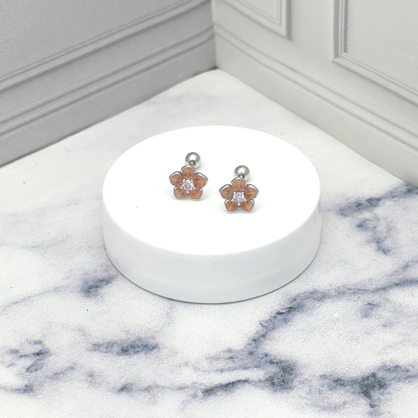 Aretes de plata con flor rosada