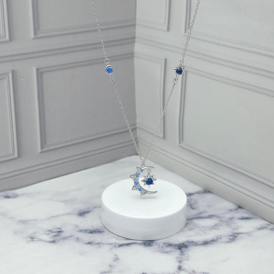 Collar de plata con luna y estrella azul