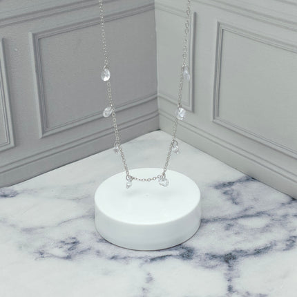 Collar de plata con dijes de circonia