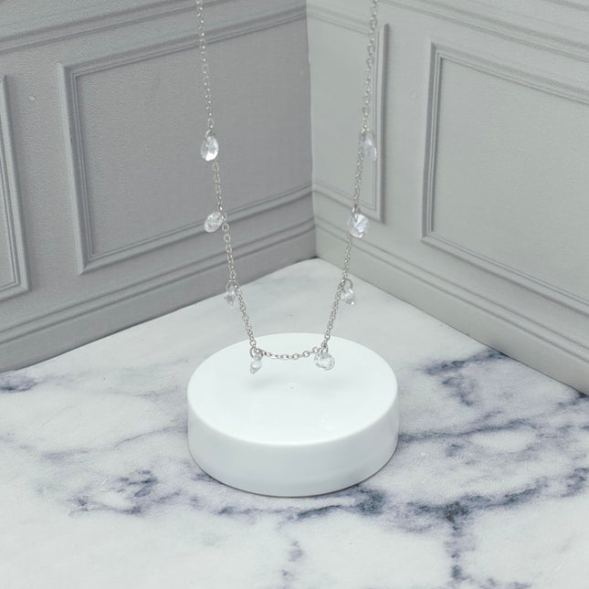 Collar de plata con dijes de circonia