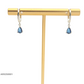 Aretes tipo argolla con piedra azul en gota
